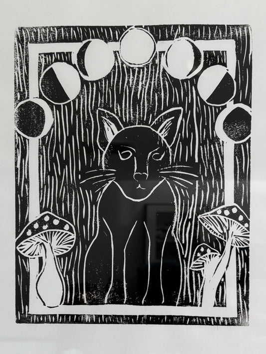 Black and white linocut print of a cat in a forest with mushrooms